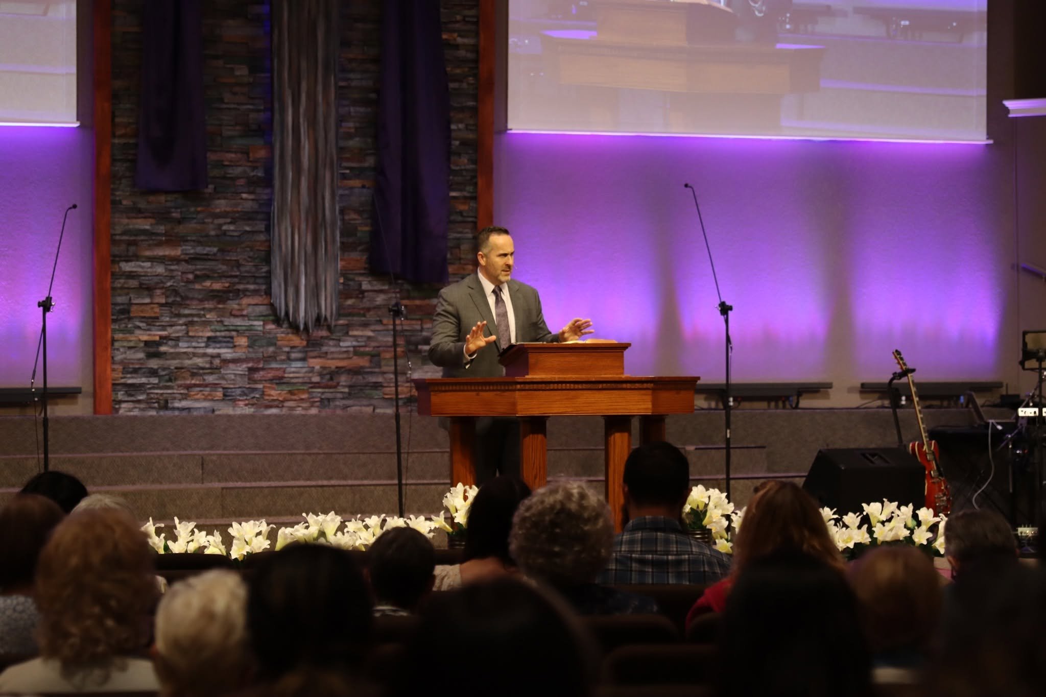 Pastor preaching from the pulpit in the sanctuary on Easter Sunday